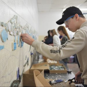 Tiling Students adding tile to the wall