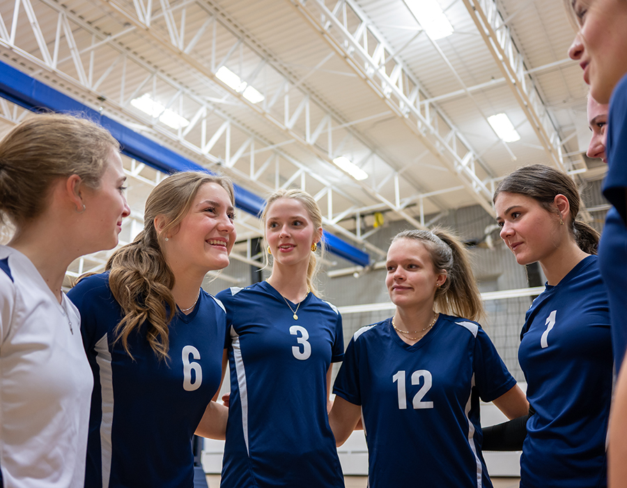 Girls volleyball team huddle