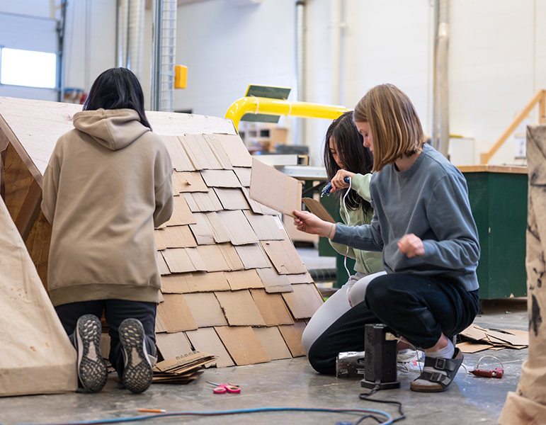 students working on prop in art club