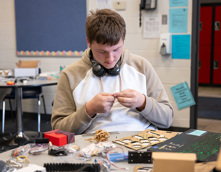 Student working on electronics