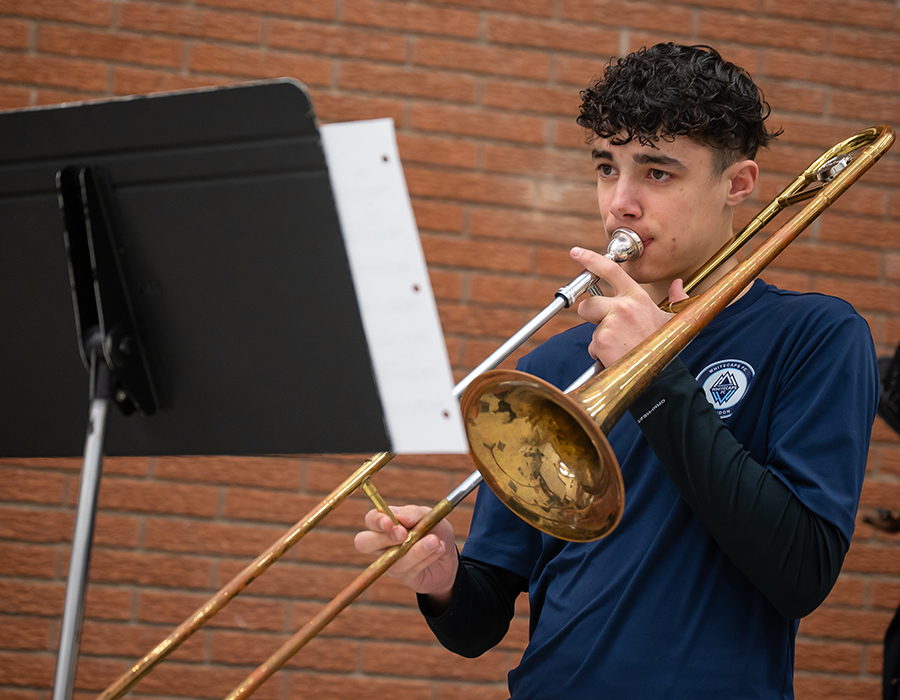 student playing trombone